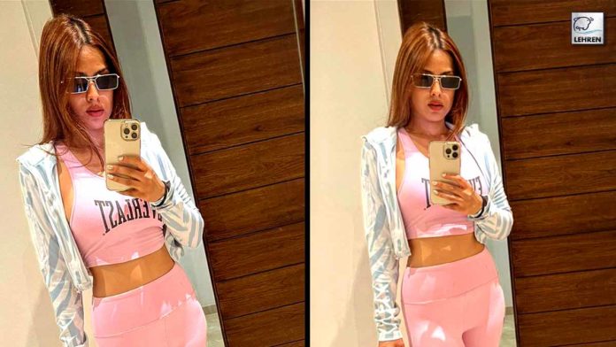 nia-sharma-flaunts-her-look-sexy-figure-in-pink-track-suit