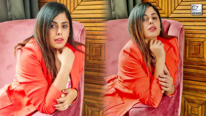 Actress Sehnoor is giving off boss lady vibes in this stylish, bold orange pantsuit