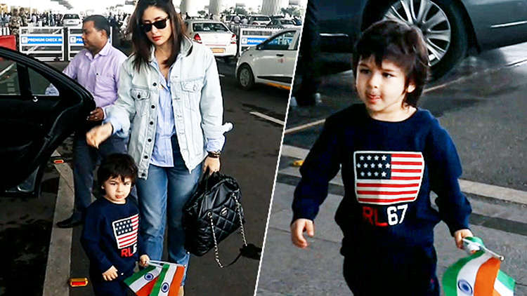 Taimur looks adorable as he waves the Indian flag at the airport