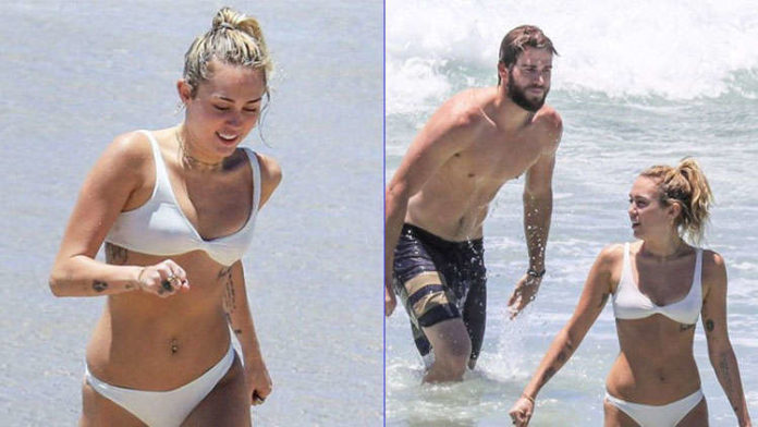 Miley Cyrus flaunts assets in a thong while vacationing with Liam Hemsworth