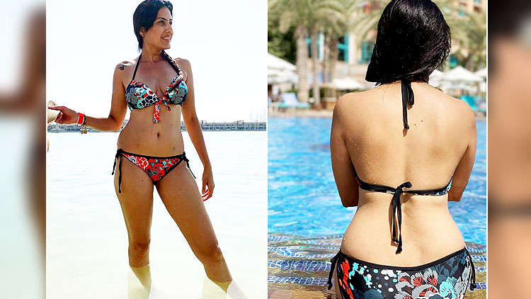 statisk Skriv en rapport rulle Kamya Panjabi flaunts her curvacious body while chilling out on a beach