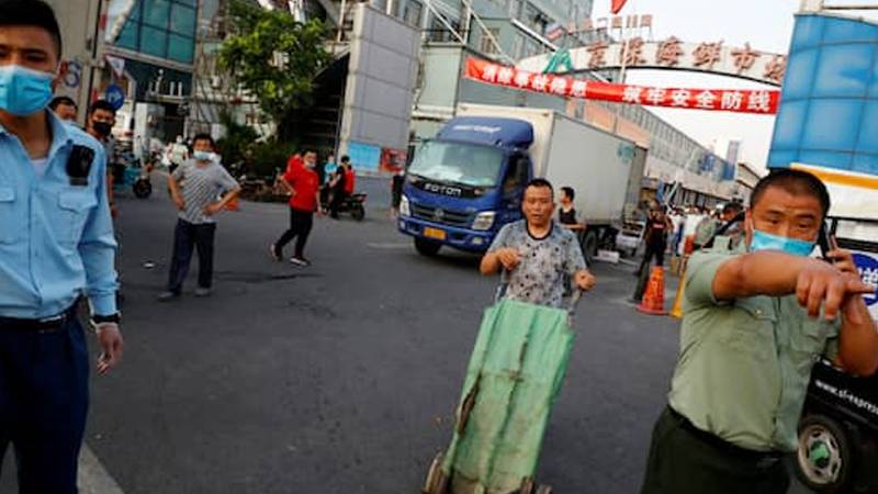 China locks down 10 more Beijing neighbourhoods over new COVID-19 cluster linked to food market