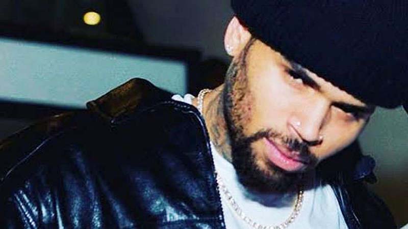 Chris Brown revealed the name of his son with a logo on his jacket?