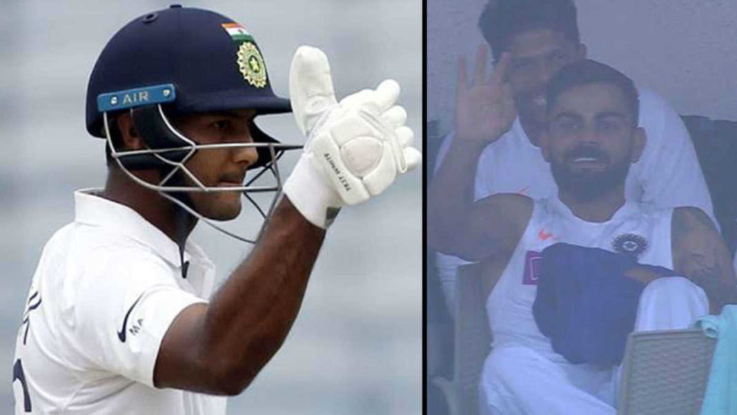 Mayank Agarwal responds with thumbs up after Virat Kohli signals him to go for 200