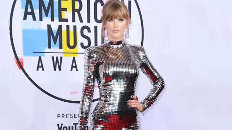 Taylor Swift reveals she is banned from performing her old hits at the AMAs