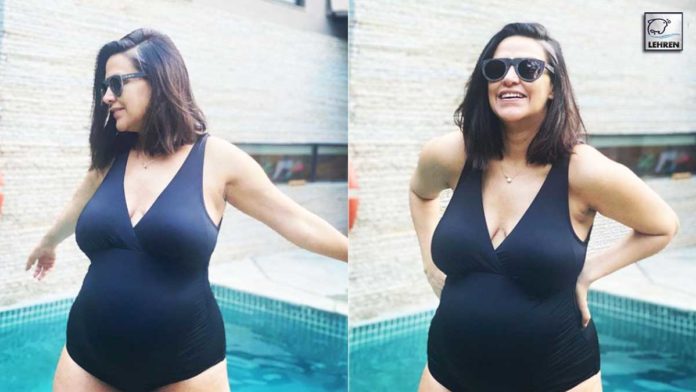 Neha Dhupia Flaunts Her Baby Bump In A Swimsuit